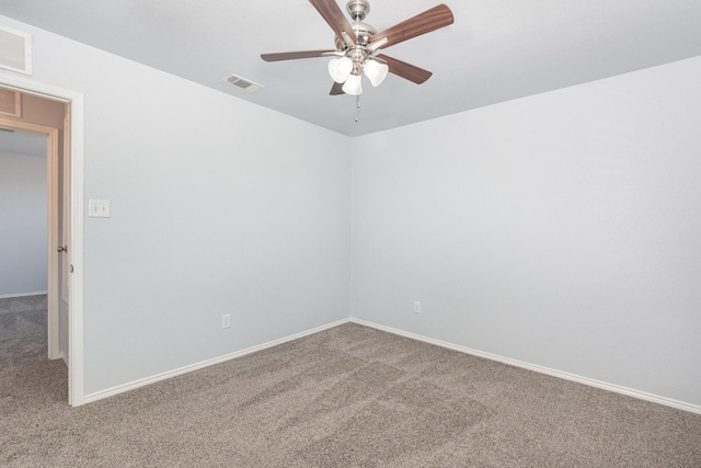 unfurnished room featuring carpet, ceiling fan, and baseboards