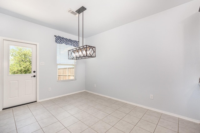 unfurnished dining area with baseboards
