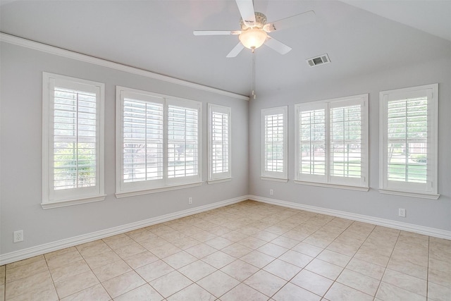 unfurnished room featuring vaulted ceiling, ceiling fan, crown molding, baseboards, and light tile patterned floors