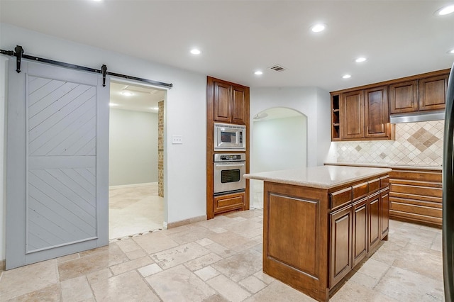 7000 County Road 527, Burleson, TX 76028 - kitchen featuring appliances with stainless steel finishes, a barn door, arched walkways, open shelves, and recessed lighting