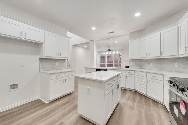10832 Hawks Landing Rd, Fort Worth, TX 76052 - kitchen with electric range, light wood-style flooring, tasteful backsplash, white cabinets, and recessed lighting