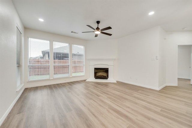 10832 Hawks Landing Rd, Fort Worth, TX 76052 - unfurnished living room featuring ceiling fan, light wood-style floors, baseboards, and recessed lighting