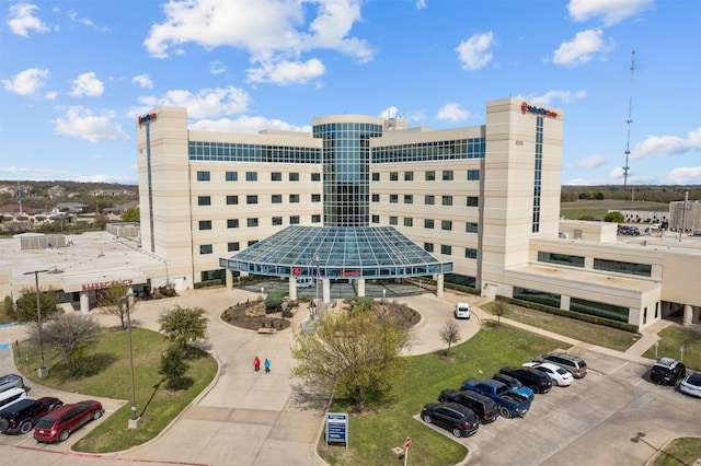 view of property featuring uncovered parking
