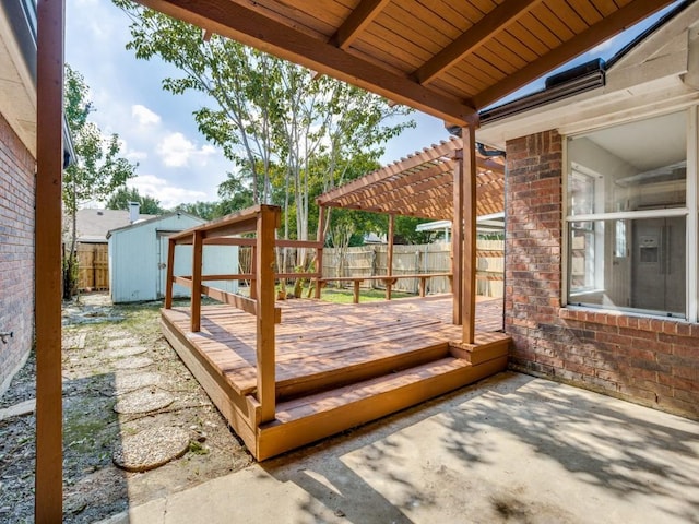 deck featuring a storage shed, a fenced backyard, a pergola, and an outdoor structure