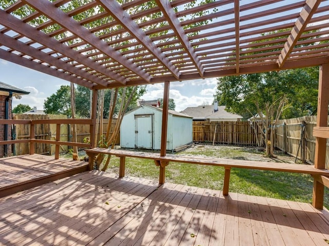 deck with a storage unit, an outdoor structure, and a pergola