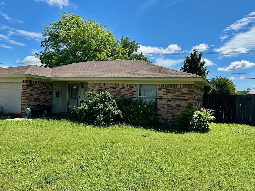 single story home featuring brick siding and an attached garage