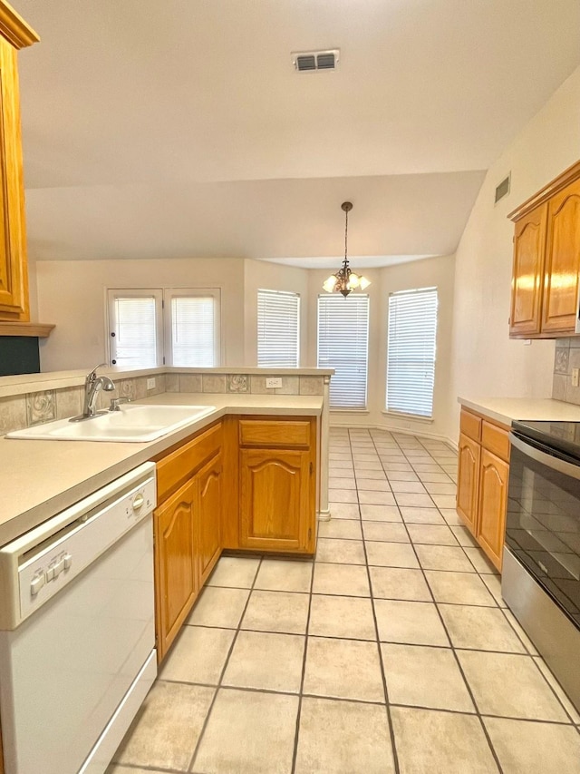 kitchen with dishwasher, stainless steel electric range oven, a sink, light tile patterned floors, and light countertops