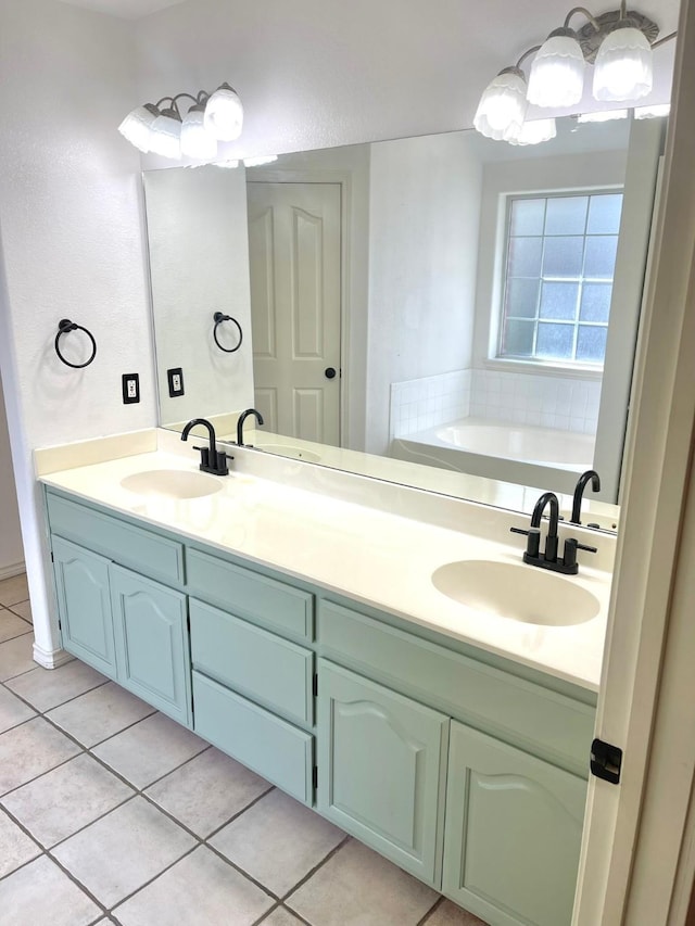 bathroom with tile patterned flooring, double vanity, and a bath