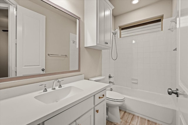 8325 Western, The Colony, TX 75056 - bathroom with toilet, vanity, shower / bath combination, recessed lighting, and wood finished floors