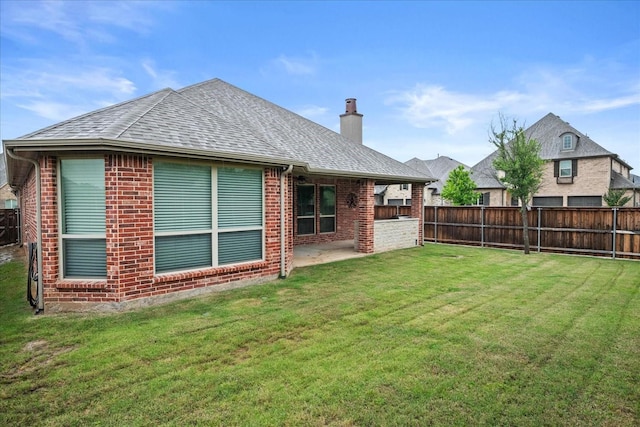 8325 Western, The Colony, TX 75056 - back of property with brick siding, a chimney, a patio, and a shingled roof