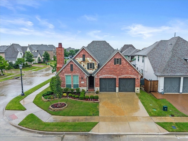 8325 Western, The Colony, TX 75056 - view of front of property featuring brick siding, a chimney, concrete driveway, and a residential view
