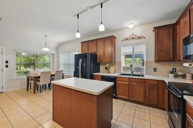 6008 Creekway Dr, Denton, TX 76226 - kitchen with black appliances, a sink, light tile patterned floors, decorative backsplash, and lofted ceiling