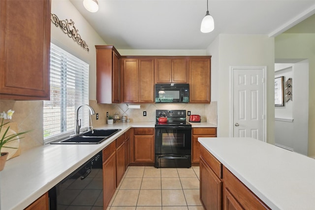 6008 Creekway Dr, Denton, TX 76226 - kitchen with black appliances, a sink, light countertops, and backsplash