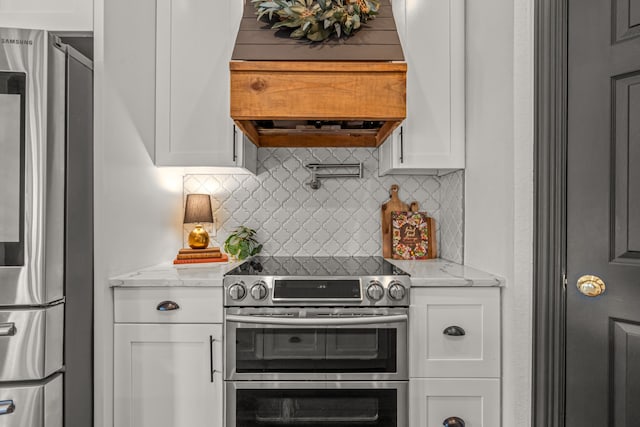 147 Rim Rock Rd, Aledo, TX 76008 - kitchen with appliances with stainless steel finishes, white cabinetry, backsplash, and light stone countertops