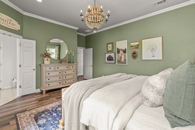 147 Rim Rock Rd, Aledo, TX 76008 - bedroom with a chandelier, wood finished floors, crown molding, and baseboards