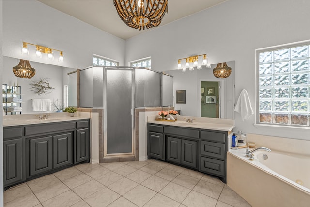 147 Rim Rock Rd, Aledo, TX 76008 - full bathroom with a chandelier, two vanities, a stall shower, a garden tub, and tile patterned flooring