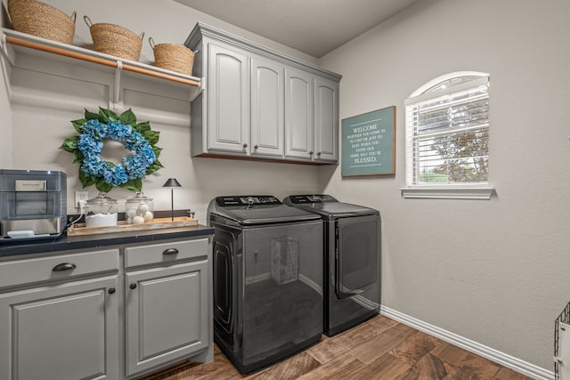 147 Rim Rock Rd, Aledo, TX 76008 - laundry area with washing machine and clothes dryer, cabinet space, baseboards, and wood finished floors