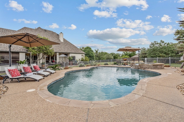 147 Rim Rock Rd, Aledo, TX 76008 - view of swimming pool featuring a patio area, a fenced backyard, and a pool with connected hot tub