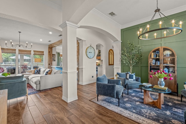 147 Rim Rock Rd, Aledo, TX 76008 - living area with a chandelier, decorative columns, ornamental molding, wood finished floors, and arched walkways