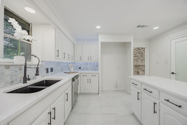 62 Legend Rd, Benbrook, TX 76132 - kitchen with a sink, stainless steel dishwasher, white cabinets, light marble finish flooring, and recessed lighting