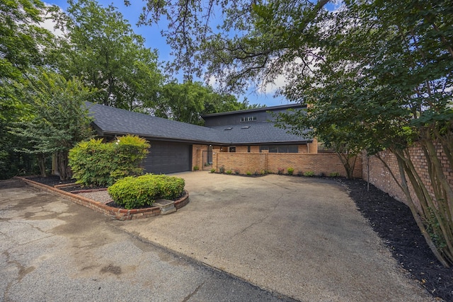 62 Legend Rd, Benbrook, TX 76132 - view of front of property featuring driveway, a garage, brick siding, and a shingled roof
