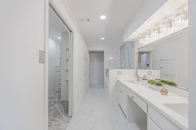 62 Legend Rd, Benbrook, TX 76132 - full bath with marble look tile flooring, double vanity, recessed lighting, baseboards, and crown molding