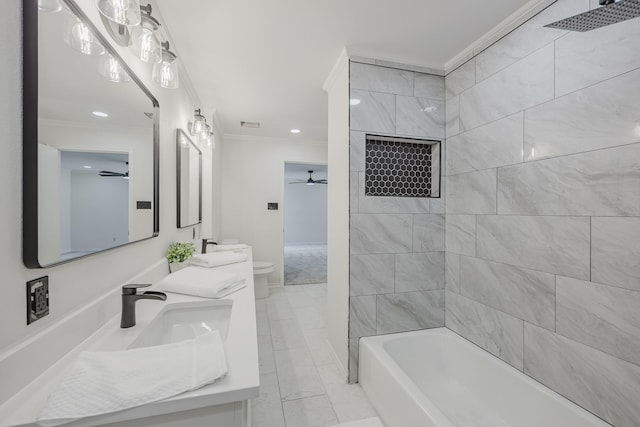 62 Legend Rd, Benbrook, TX 76132 - bathroom featuring ornamental molding, marble look tiles, double vanity, ceiling fan, and toilet