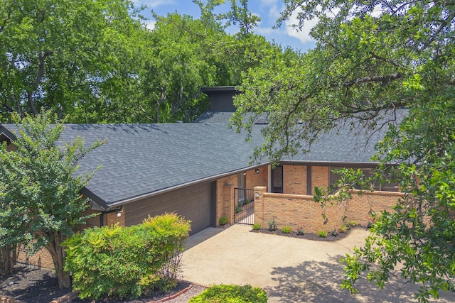 62 Legend Rd, Benbrook, TX 76132 - view of front of home featuring concrete driveway, roof with shingles, brick siding, a garage, and a gate