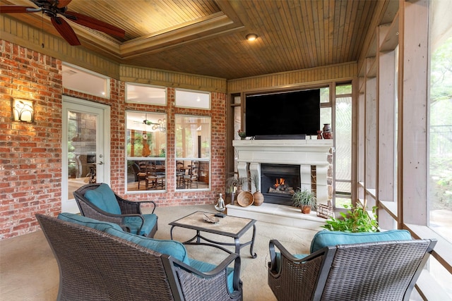 1413 Hunters Ridge Cir, Denton, TX 76205 - sunroom / solarium featuring a ceiling fan and an outdoor living space with a fireplace