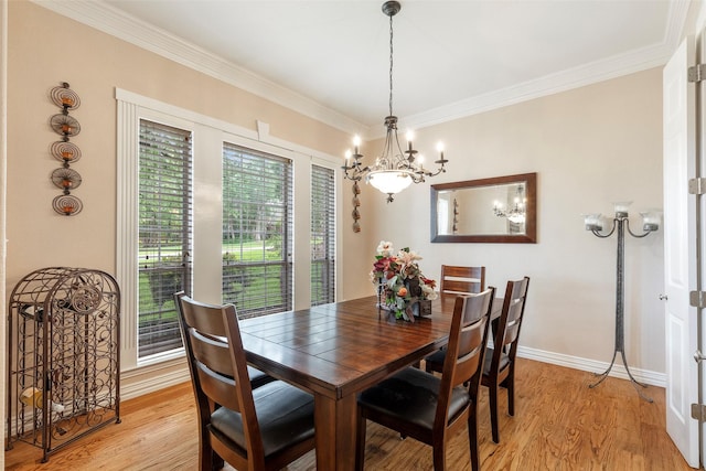 1413 Hunters Ridge Cir, Denton, TX 76205 - dining room featuring a chandelier, crown molding, light wood-style floors, and baseboards