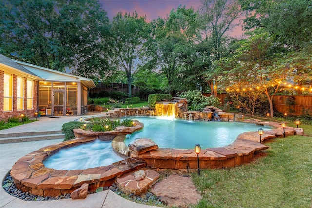 1413 Hunters Ridge Cir, Denton, TX 76205 - pool at dusk featuring a sunroom and a patio area