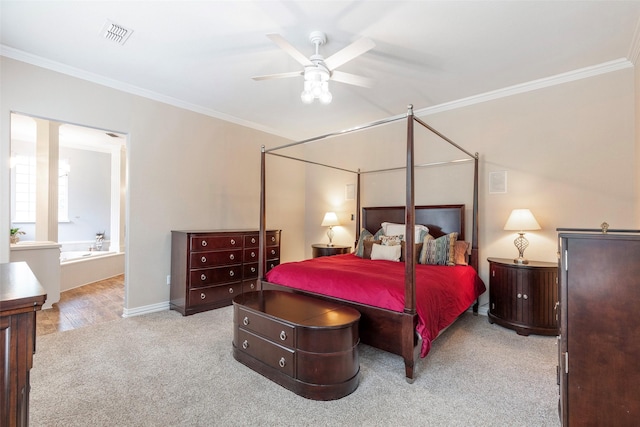 1413 Hunters Ridge Cir, Denton, TX 76205 - carpeted bedroom featuring ornamental molding, ensuite bath, baseboards, and ceiling fan