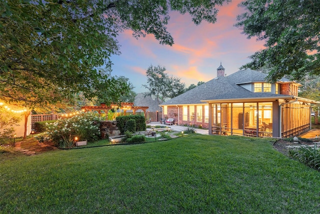 1413 Hunters Ridge Cir, Denton, TX 76205 - rear view of property featuring a patio area, a sunroom, a shingled roof, a chimney, and a pergola