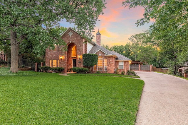 1413 Hunters Ridge Cir, Denton, TX 76205 - traditional-style house featuring brick siding, a chimney, and concrete driveway