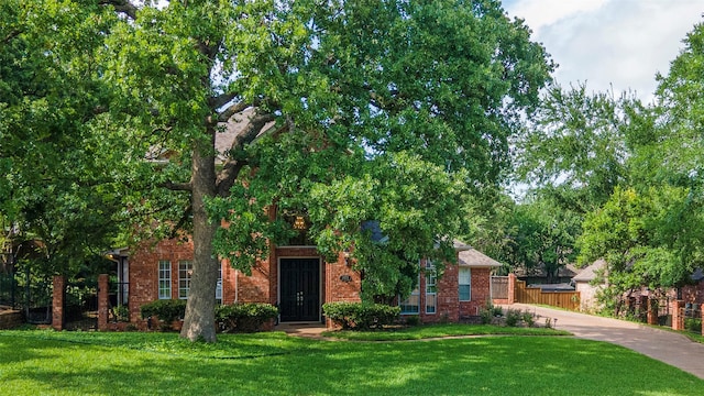 1413 Hunters Ridge Cir, Denton, TX 76205 - obstructed view of property with brick siding and driveway