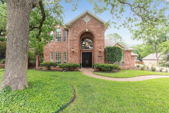 1413 Hunters Ridge Cir, Denton, TX 76205 - traditional-style house featuring brick siding and a front yard