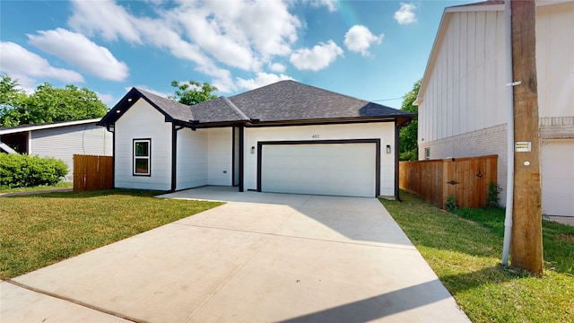 402 Perry Ave, Waxahachie, TX 75165 - view of front of house with an attached garage, driveway, and roof with shingles
