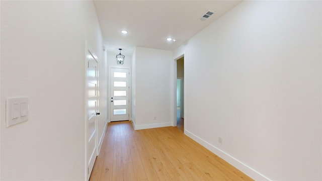 402 Perry Ave, Waxahachie, TX 75165 - hall with light wood finished floors, recessed lighting, and baseboards