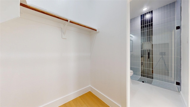 402 Perry Ave, Waxahachie, TX 75165 - walk in closet with light wood-style floors