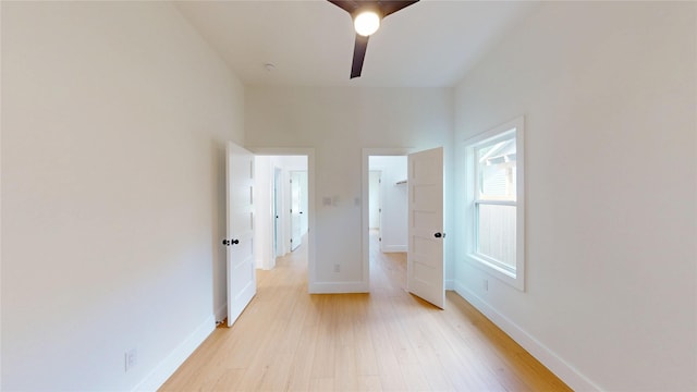 402 Perry Ave, Waxahachie, TX 75165 - unfurnished bedroom featuring light wood-type flooring, baseboards, and ceiling fan