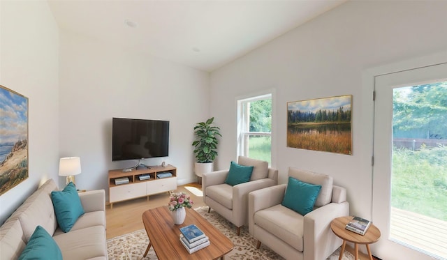 402 Perry Ave, Waxahachie, TX 75165 - living area featuring wood finished floors and vaulted ceiling