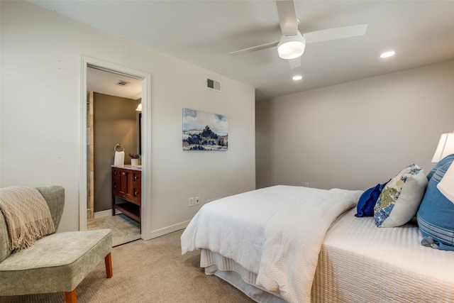 bedroom with light carpet, recessed lighting, a ceiling fan, baseboards, and ensuite bathroom