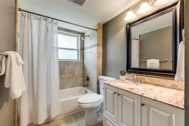 bathroom featuring toilet, vanity, shower / bathtub combination with curtain, and tile patterned flooring