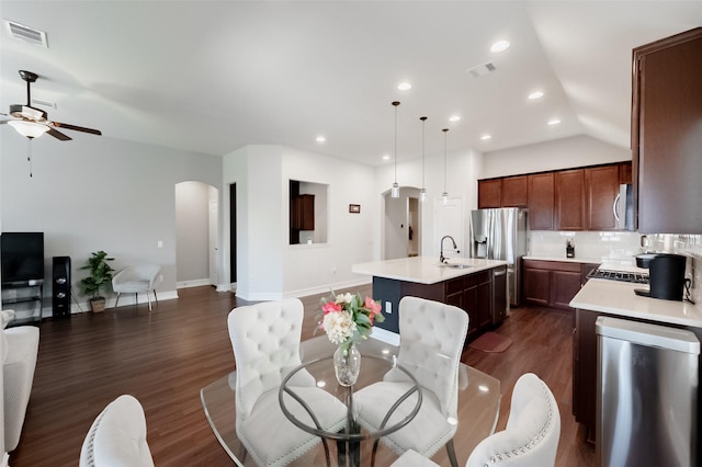 2507 Linwood Dr, Mansfield, TX 76084 - dining space with a ceiling fan, arched walkways, dark wood-style floors, lofted ceiling, and recessed lighting