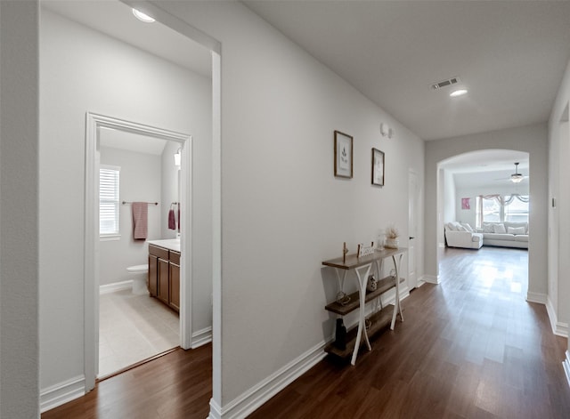 2507 Linwood Dr, Mansfield, TX 76084 - corridor with dark wood finished floors, arched walkways, baseboards, and recessed lighting