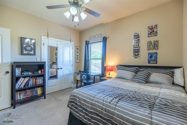 carpeted bedroom with a ceiling fan