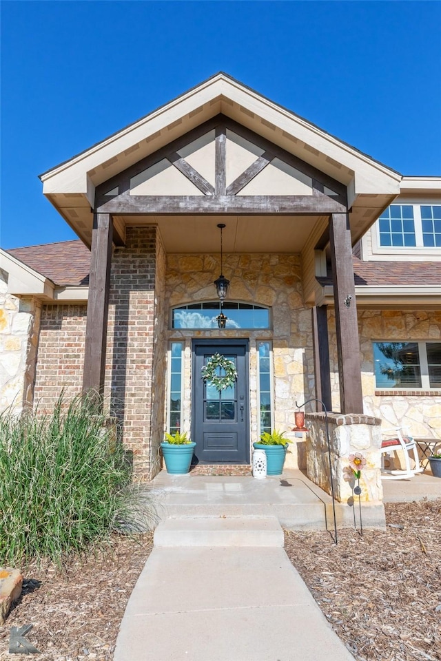 view of exterior entry featuring stone siding