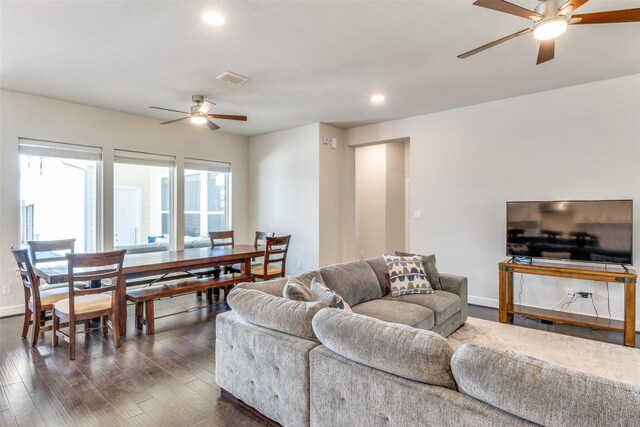 living area featuring ceiling fan, dark wood-type flooring, recessed lighting, and baseboards