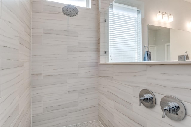 full bath featuring a tile shower