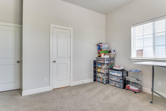 rec room featuring carpet flooring and baseboards